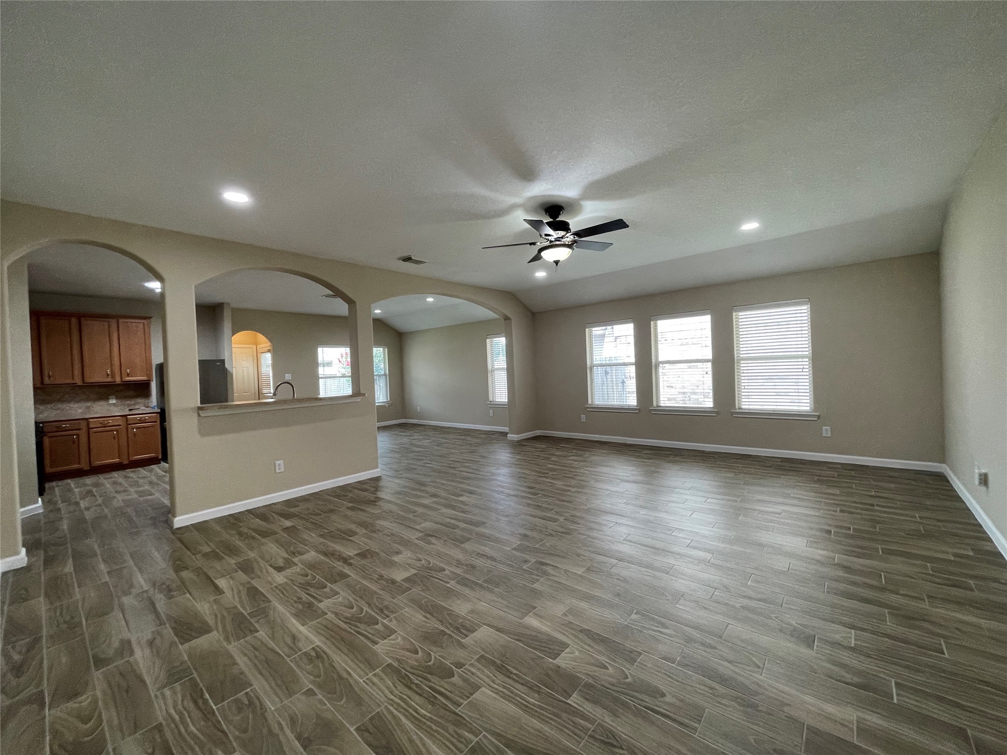 6110 Moran Crest Drive Spring, TX 77388 - Photo 21 of 49 an empty room with wooden floor and windows