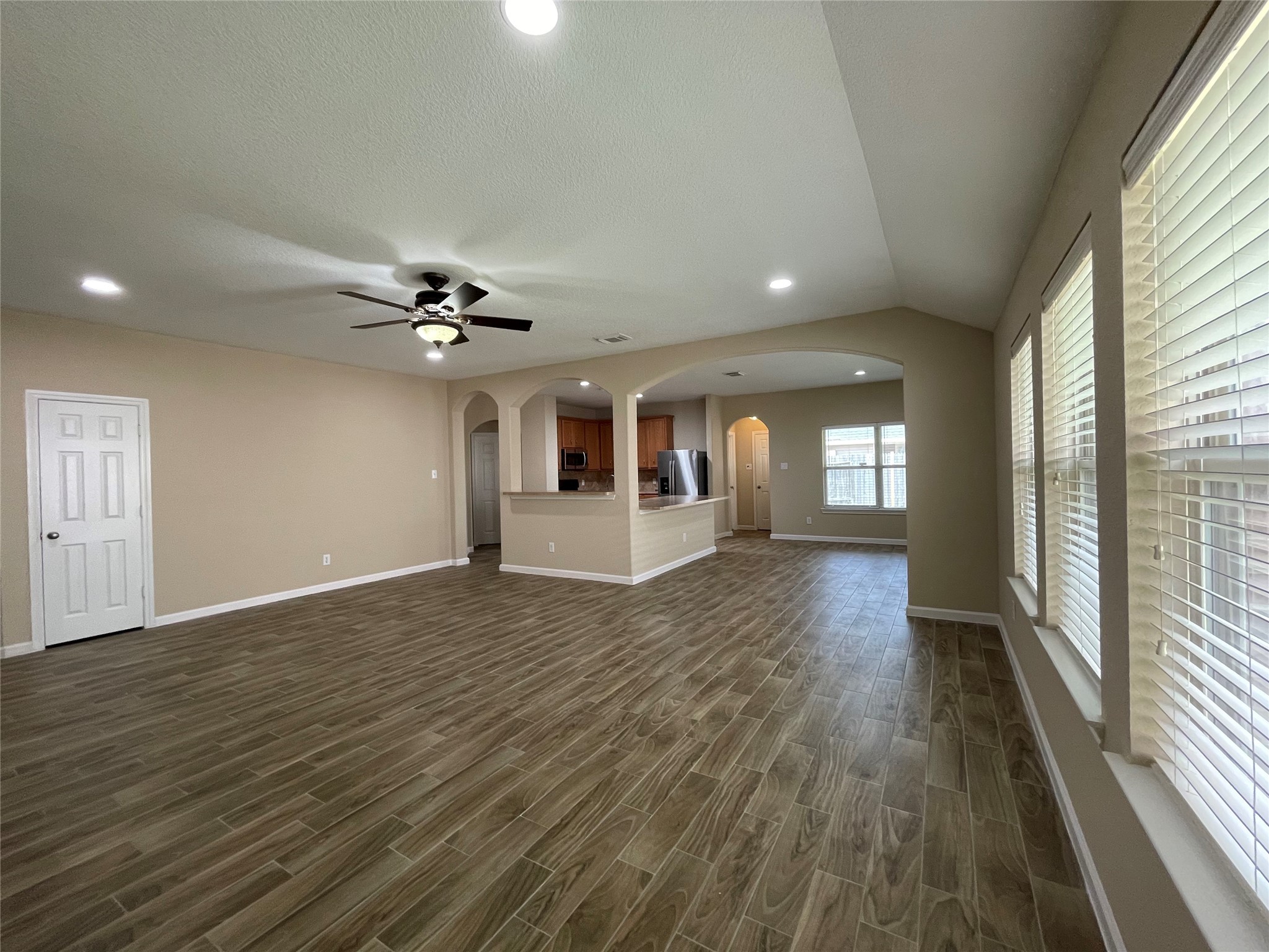 6110 Moran Crest Drive Spring, TX 77388 - Photo 22 of 49 a view of a livingroom with a furniture wooden floor and chandelier