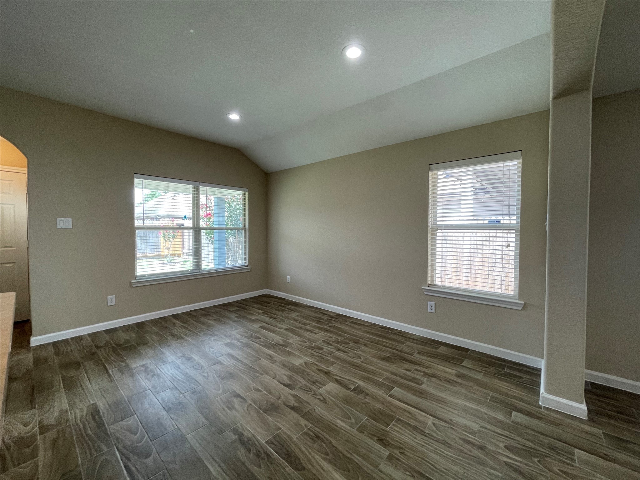 6110 Moran Crest Drive Spring, TX 77388 - Photo 23 of 49 an empty room with wooden floor and windows