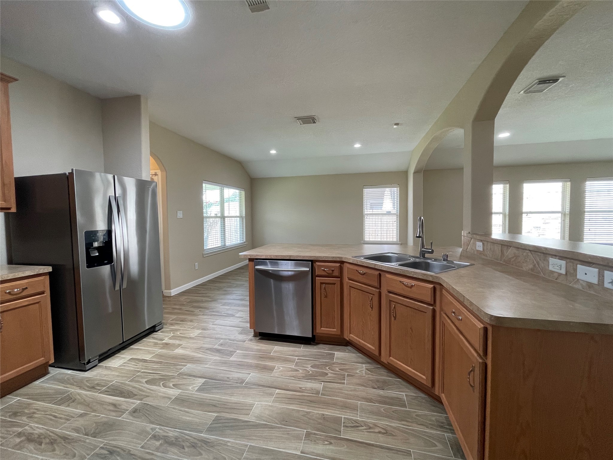 6110 Moran Crest Drive Spring, TX 77388 - Photo 29 of 49 a large kitchen with stainless steel appliances granite countertop a sink and a refrigerator