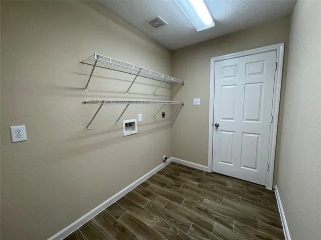 a view of a room with racks on the wall