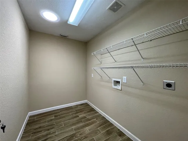 a view of a room with racks on the wall