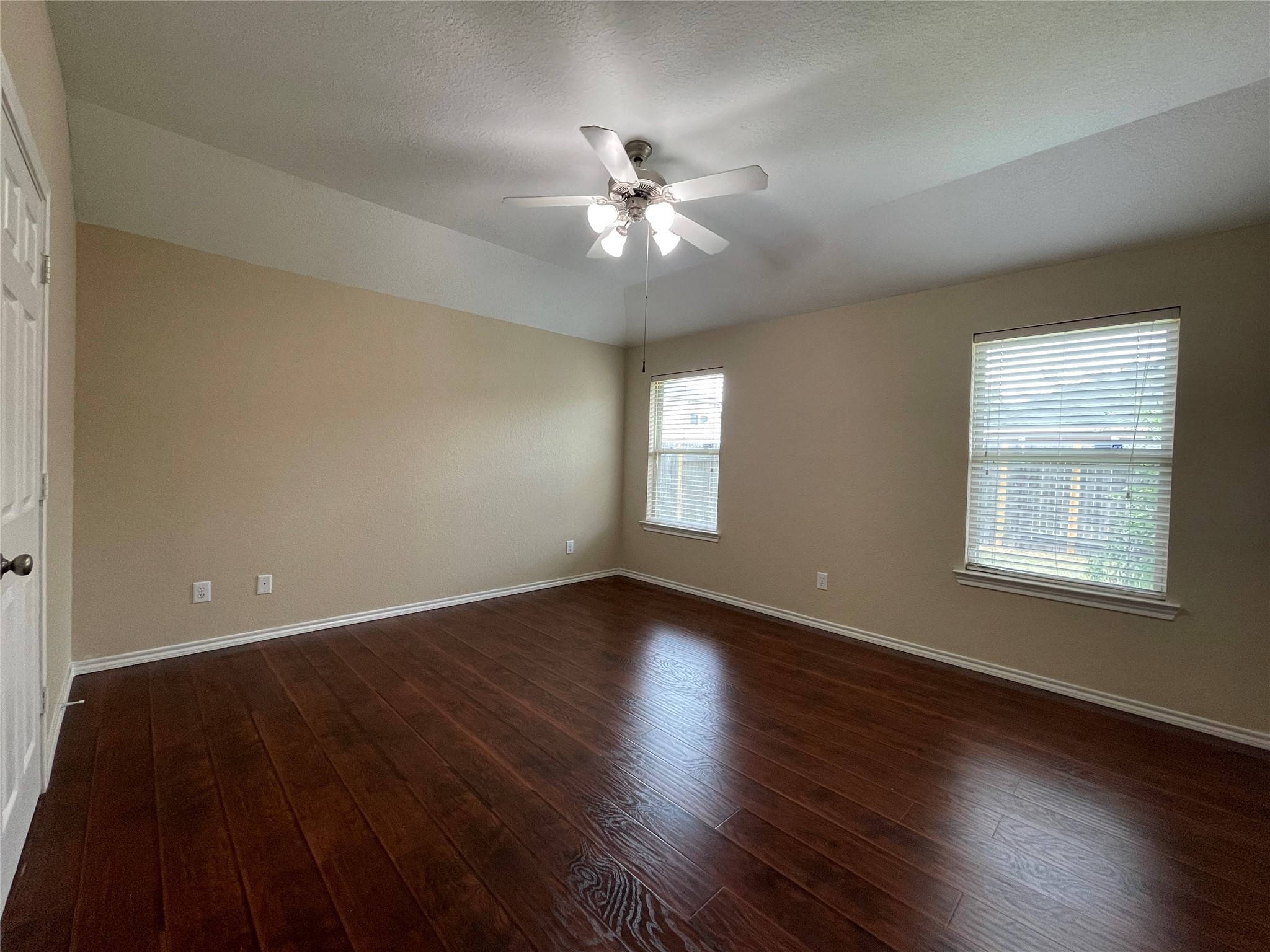 6110 Moran Crest Drive Spring, TX 77388 - Photo 36 of 49 a view of an empty room with wooden floor and a window