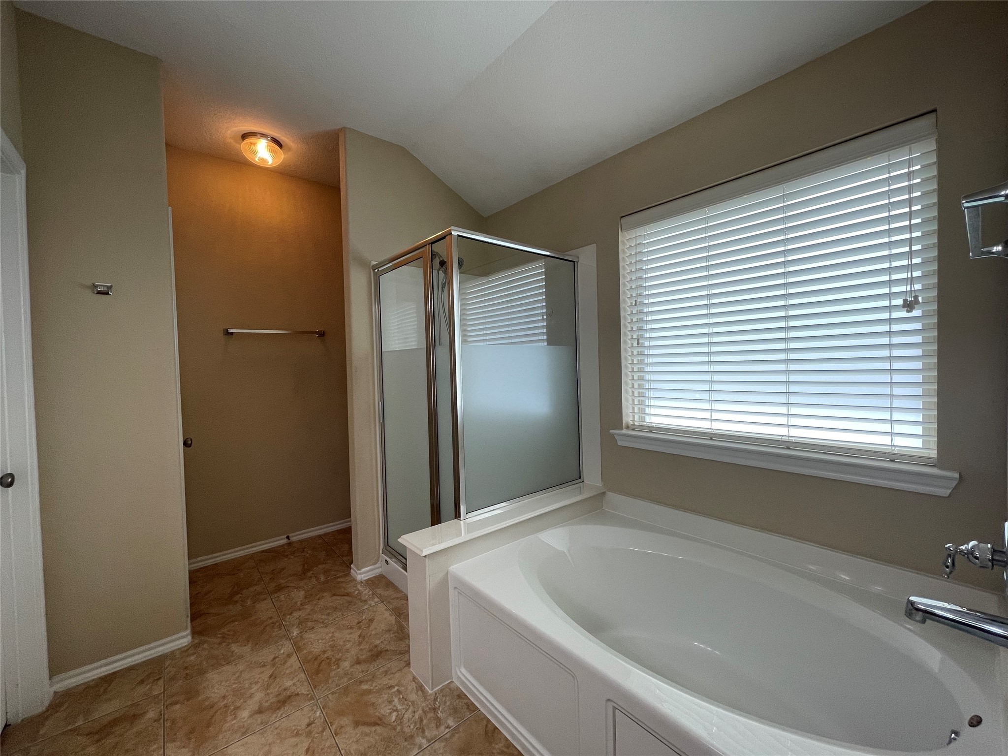 6110 Moran Crest Drive Spring, TX 77388 - Photo 37 of 49 a bathroom with a bathtub and a shower