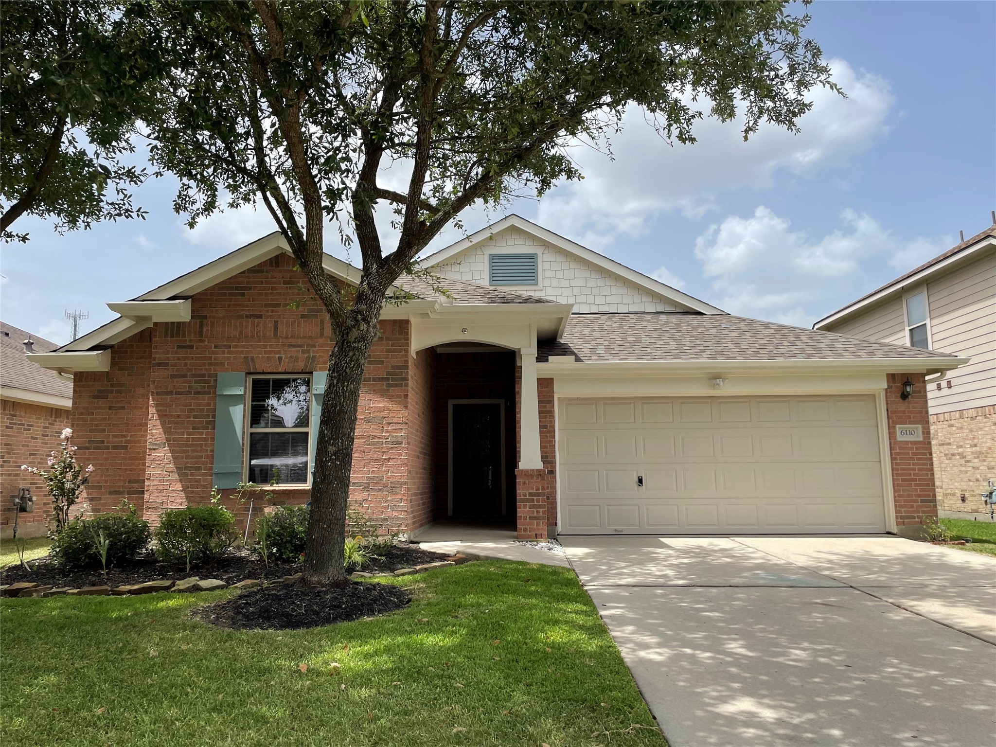 6110 Moran Crest Drive Spring, TX 77388 - Photo 4 of 49 a front view of a house with a yard and garage