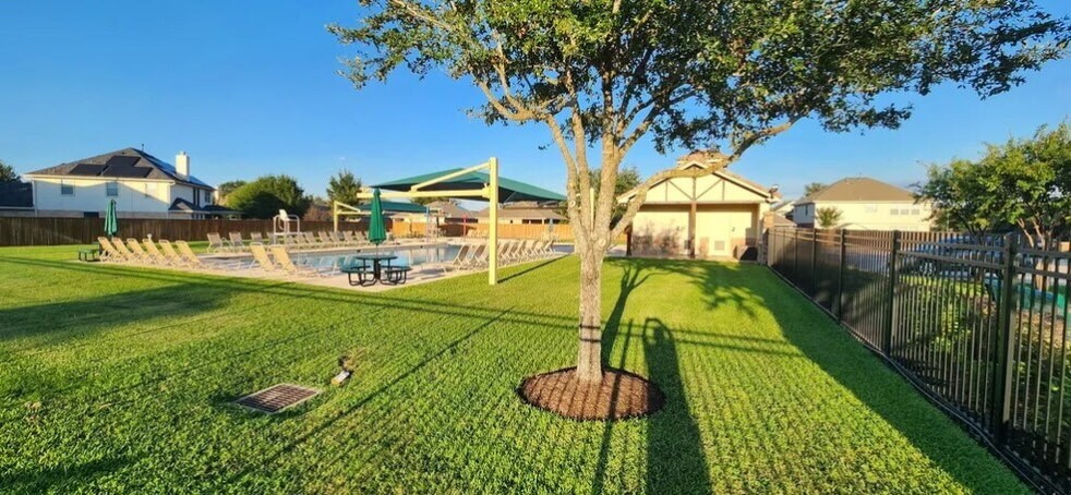 6110 Moran Crest Drive Spring, TX 77388 - Photo 48 of 49 a view of a swimming pool with a garden