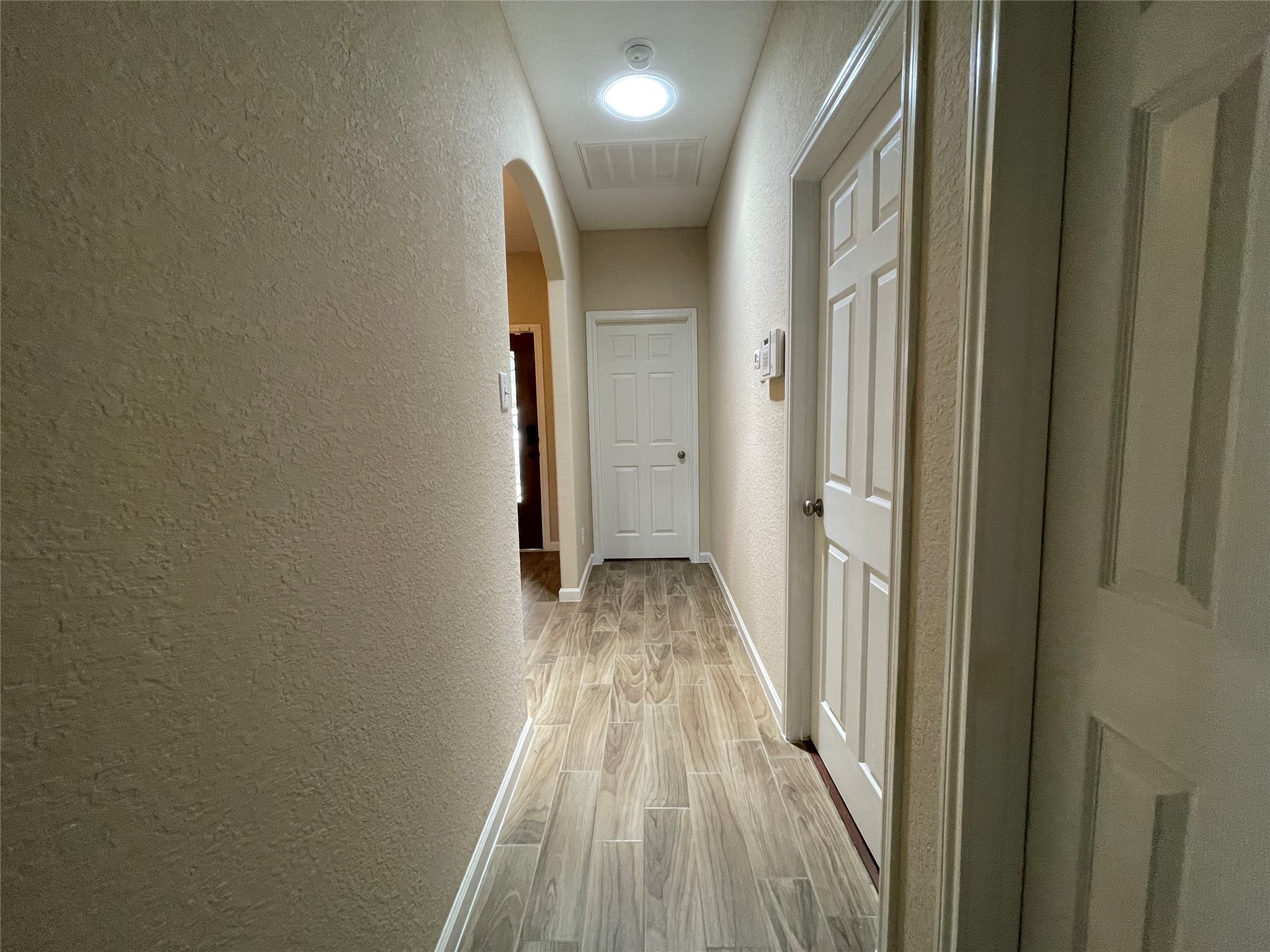 6110 Moran Crest Drive Spring, TX 77388 - Photo 7 of 49 a view of a hallway with wooden floor