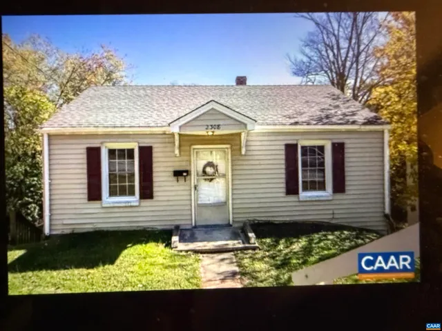a view of a brick house with a large window