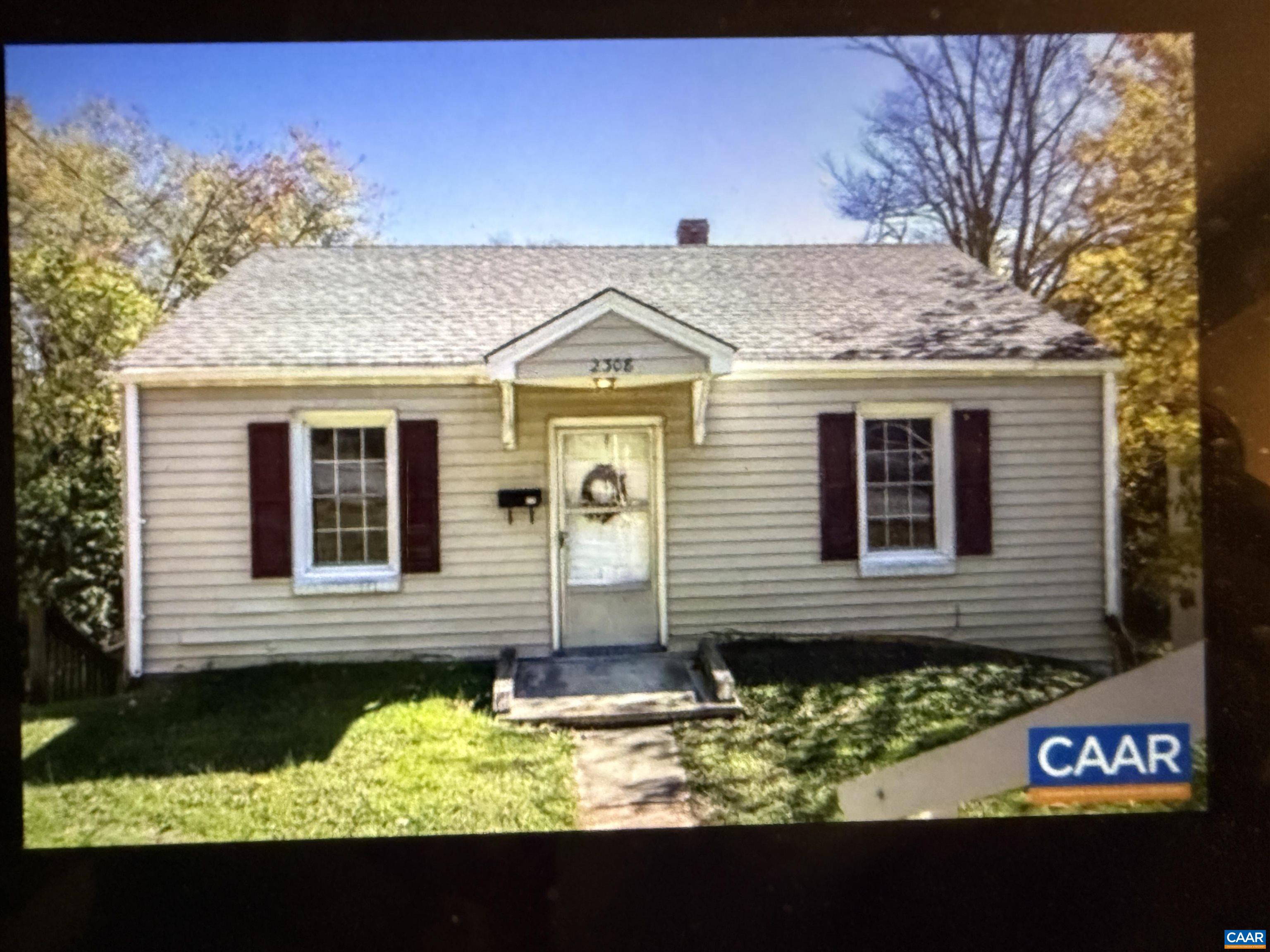a view of a brick house with a large window