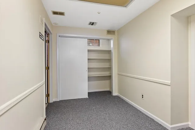 a view of an empty walk in closet