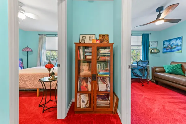 a living room with furniture a rug and a chandelier
