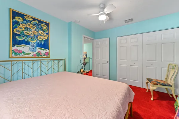 a bathroom with a sink mirror and toilet