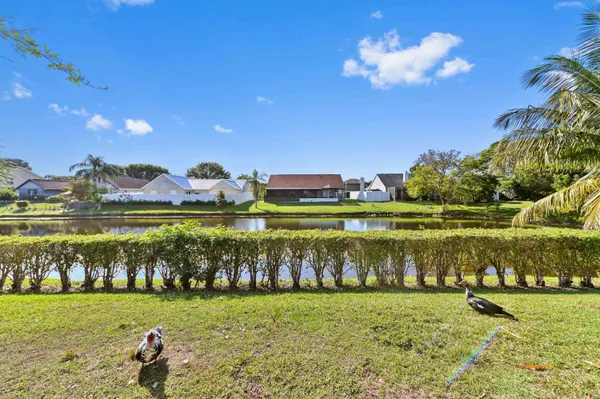 a view of a garden with a building in the background