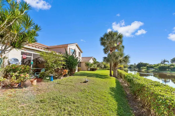 a view of a lake with houses in the back