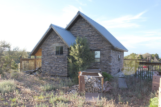 Undisclosed Address Summit, UT 84772 - Photo 6 of 24 View of property exterior with stone siding and a metal roof