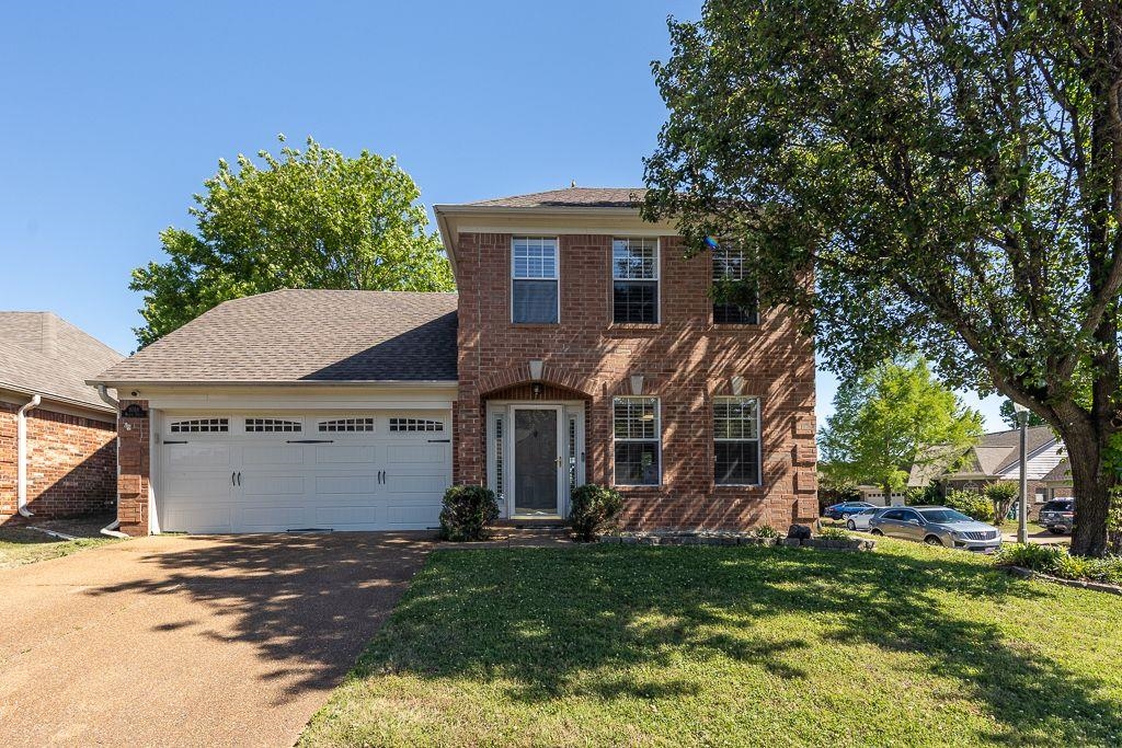 9768 Riggin Drive Memphis, TN 38002 - Photo 3 of 32 Brick exterior with a gabled roof and white trim