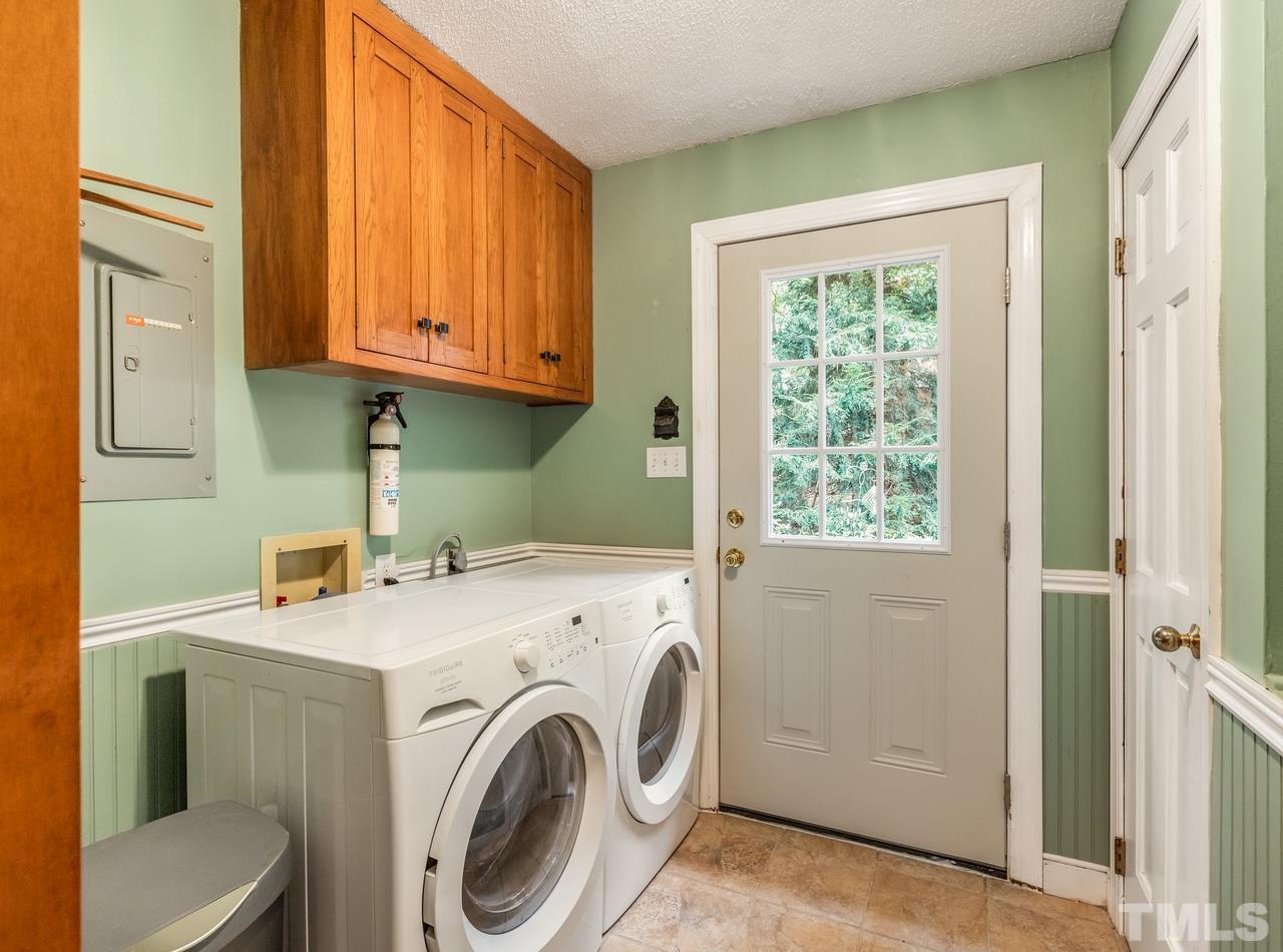 2003 Parliament Place Apex, NC 27502 - Photo 11 of 24 a utility room with dryer and washer
