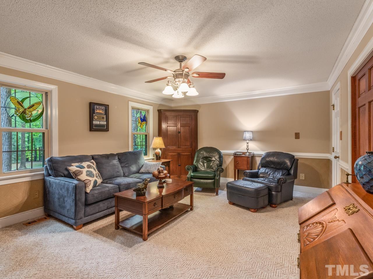 2003 Parliament Place Apex, NC 27502 - Photo 12 of 24 a living room with furniture and a large window