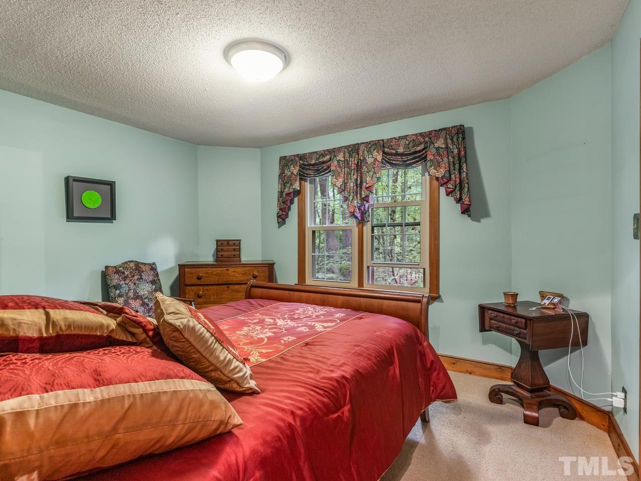 2003 Parliament Place Apex, NC 27502 - Photo 15 of 24 a bedroom with two beds and a desk