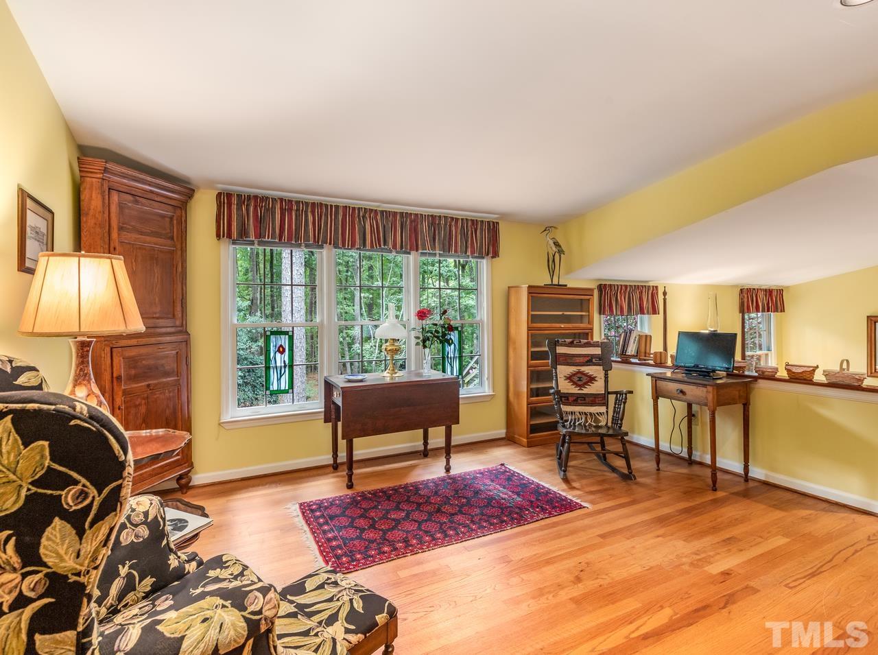 2003 Parliament Place Apex, NC 27502 - Photo 24 of 24 a living room with furniture and a lamp