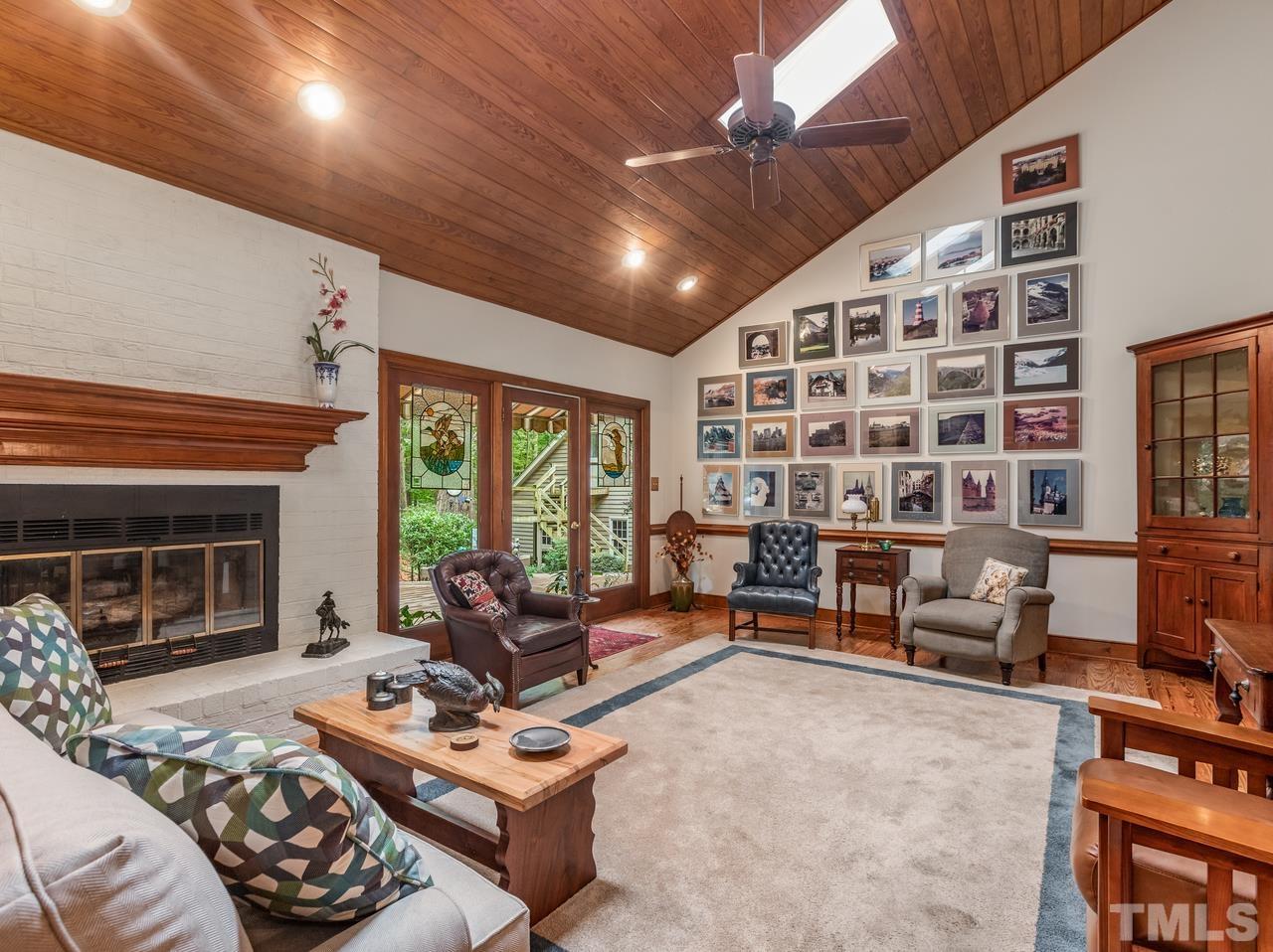 2003 Parliament Place Apex, NC 27502 - Photo 6 of 24 a living room with furniture and a fireplace
