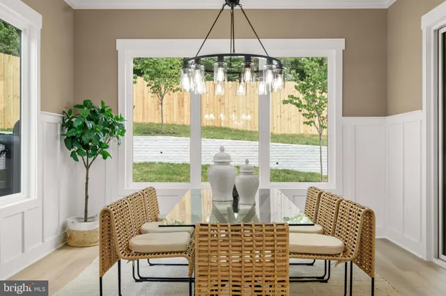 a dining room with furniture window and outside view
