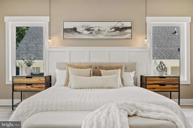 a living room with furniture and a mirror