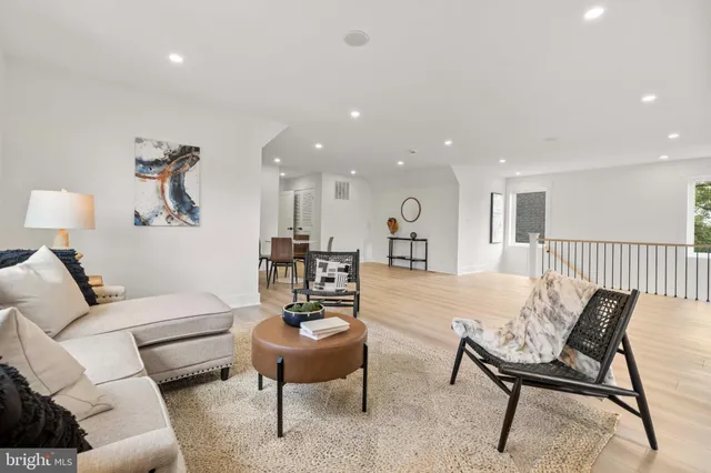 a view of a livingroom with a ceiling fan and window