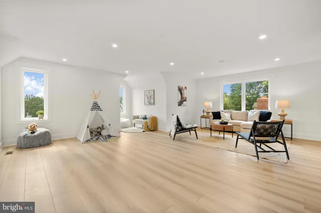 a bathroom with a sink a toilet a mirror and vanity