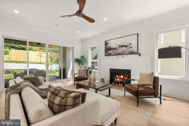 a living room with furniture or kitchen view and a wooden floor