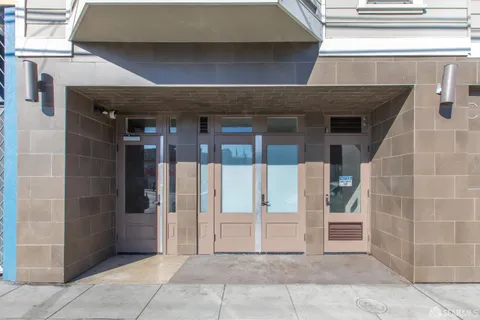 a bathroom with a shower and a sink