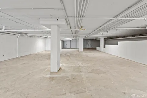 a bathroom with a sink toilet and a mirror