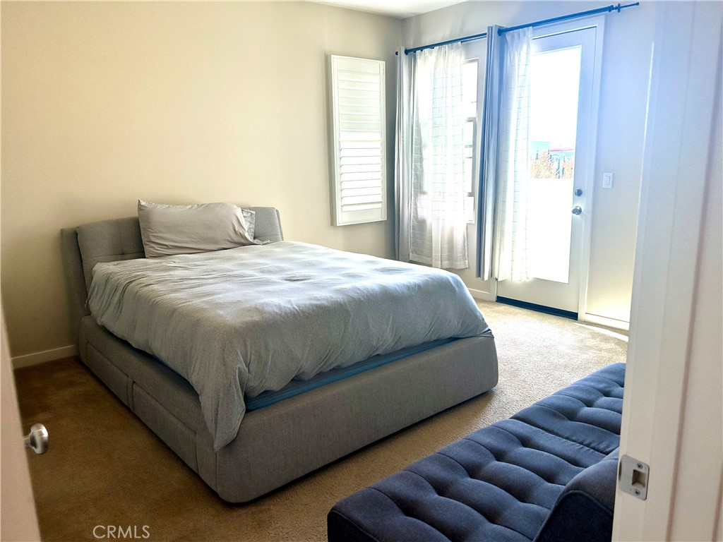 104 Briarberry Irvine, CA 92618 - Photo 14 of 27 a bedroom with bed and window