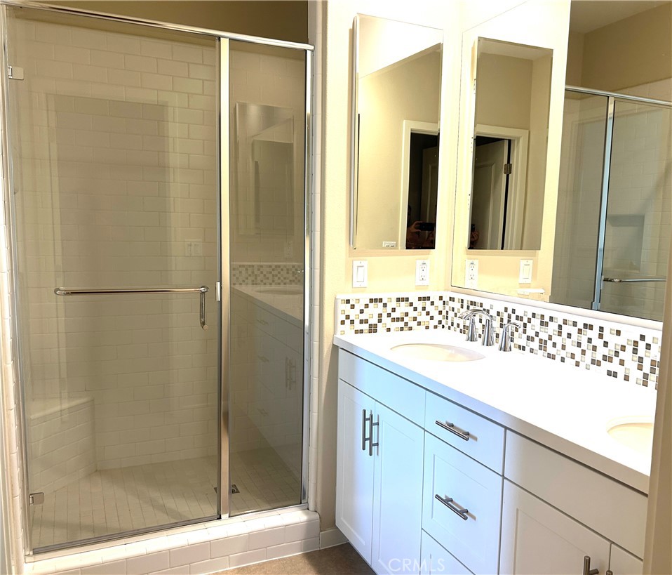 104 Briarberry Irvine, CA 92618 - Photo 15 of 27 a bathroom with a shower and a sink