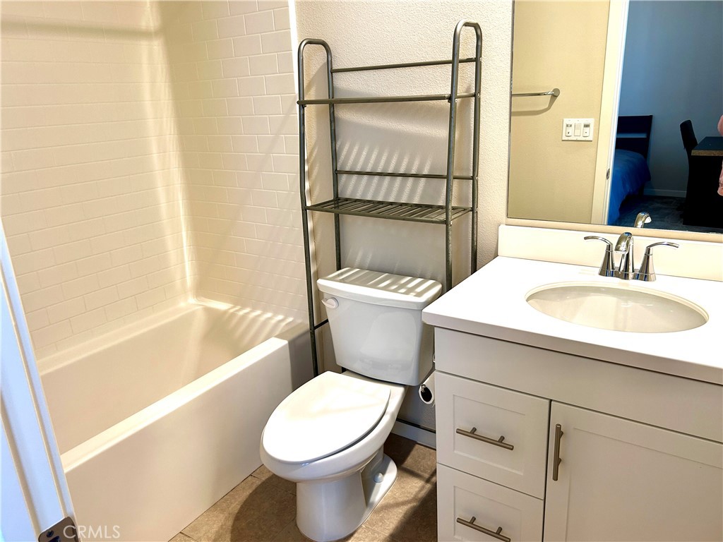 104 Briarberry Irvine, CA 92618 - Photo 19 of 27 a bathroom with a sink toilet and shower