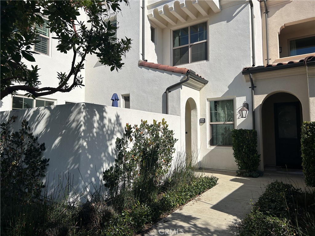 104 Briarberry Irvine, CA 92618 - Photo 2 of 27 a front view of a house with garden