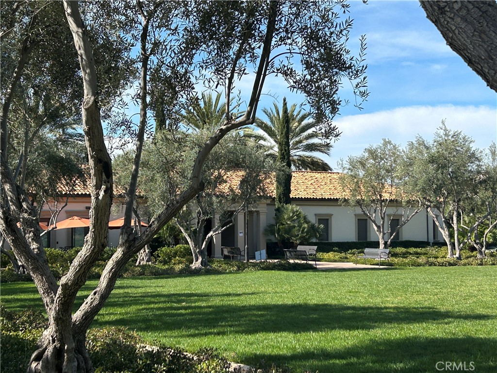104 Briarberry Irvine, CA 92618 - Photo 23 of 27 a front view of a house with a garden
