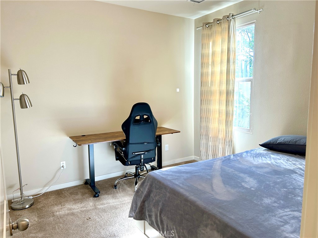 104 Briarberry Irvine, CA 92618 - Photo 4 of 27 a bedroom with a bed and a window