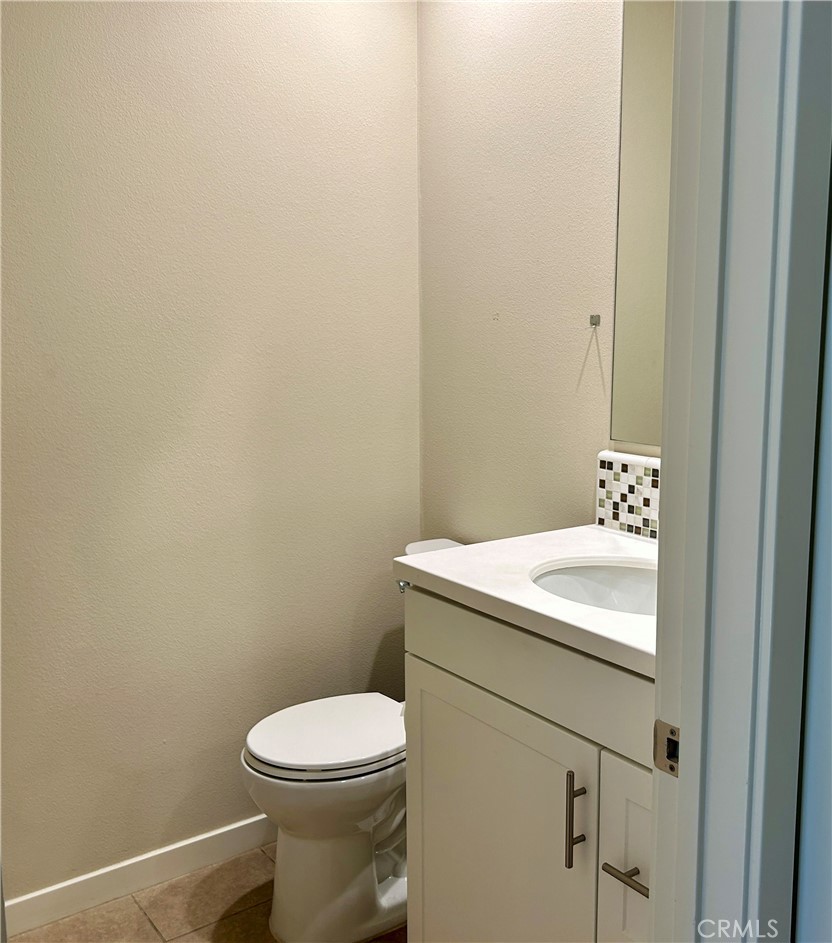 104 Briarberry Irvine, CA 92618 - Photo 5 of 27 a bathroom with a sink and a toilet