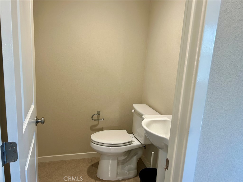 104 Briarberry Irvine, CA 92618 - Photo 8 of 27 a white toilet sitting next to a shower