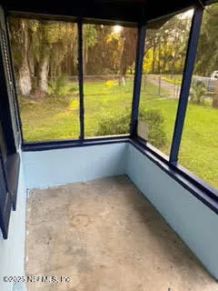 a view of a room with a large window