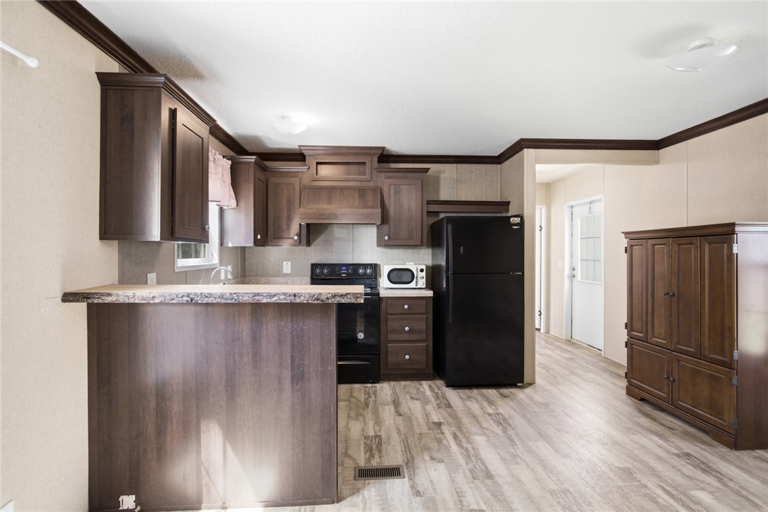 289 Bauknight Road Mountain Rest, SC 29664 - Photo 14 of 36 This spacious kitchen offers ample cabinet space and modern appliances, perfect for everyday living.