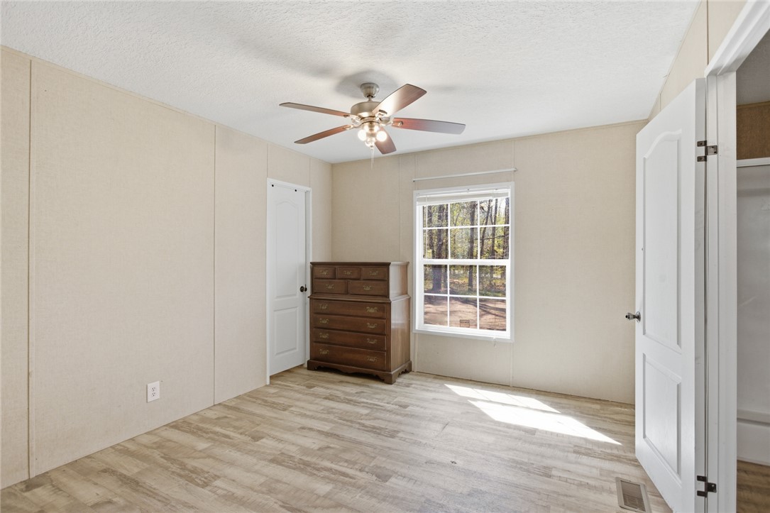 289 Bauknight Road Mountain Rest, SC 29664 - Photo 17 of 36 Bright and airy, this bedroom offers a serene retreat with expansive outdoor views.