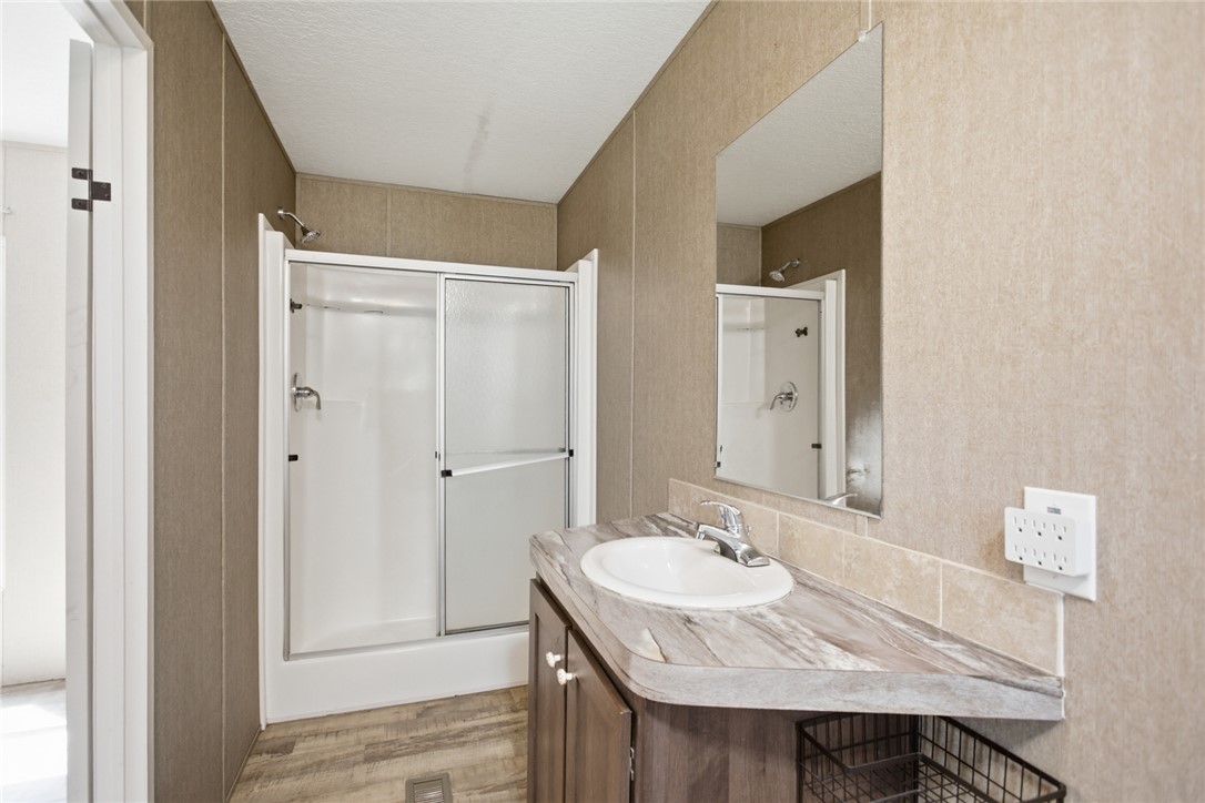 289 Bauknight Road Mountain Rest, SC 29664 - Photo 19 of 36 This clean and bright bathroom features a vanity, shower, and easy-care flooring.