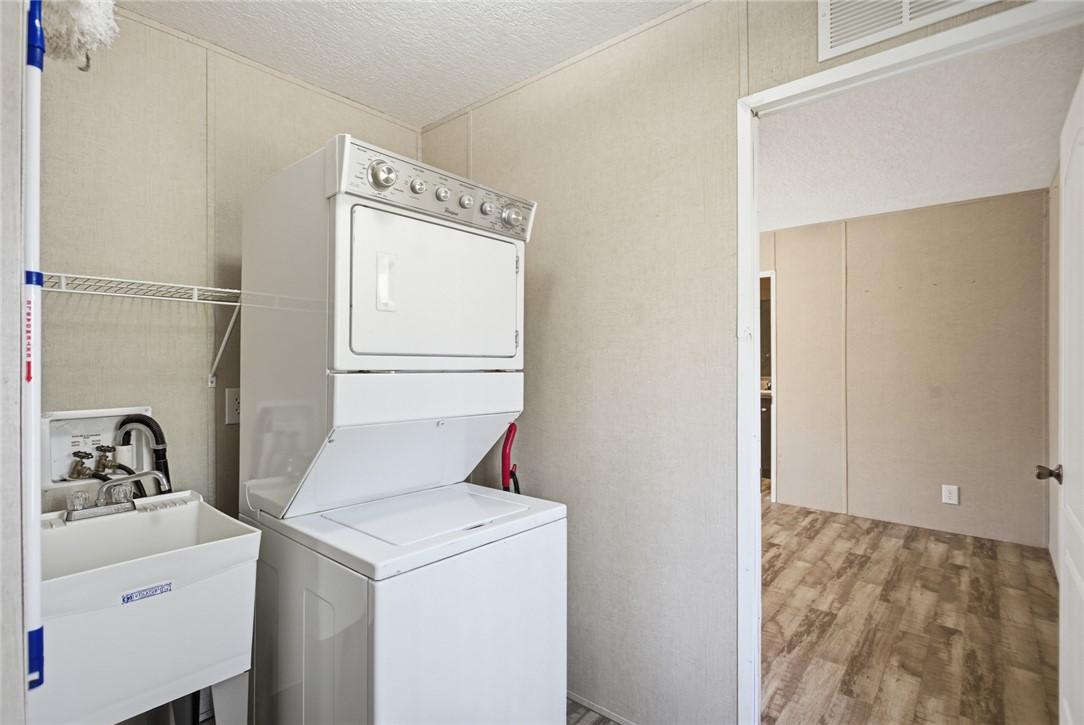 289 Bauknight Road Mountain Rest, SC 29664 - Photo 22 of 36 Functional laundry room featuring a stacked washer and dryer unit for efficient living.