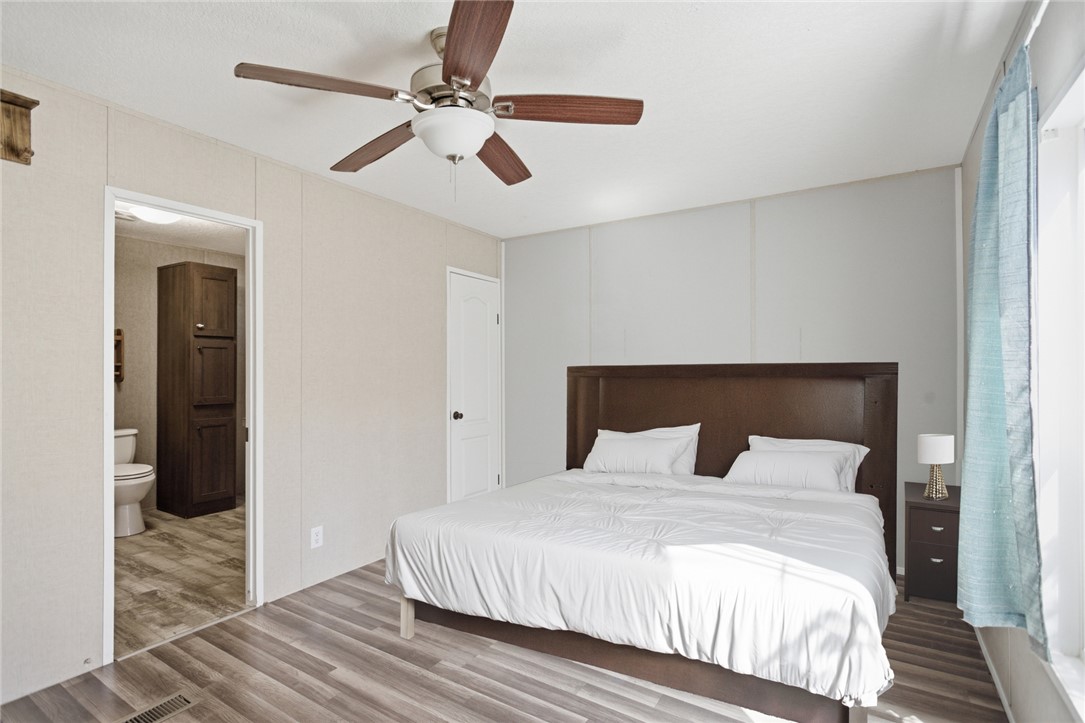 289 Bauknight Road Mountain Rest, SC 29664 - Photo 24 of 36 This spacious bedroom offers ample comfort and direct access to a private bathroom.