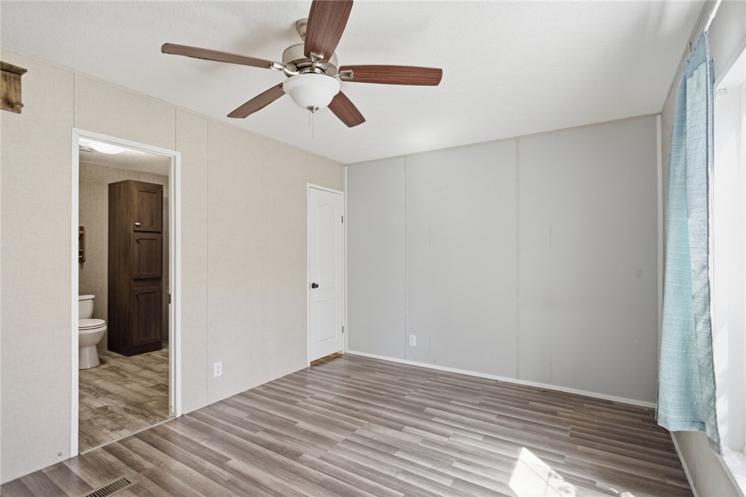 289 Bauknight Road Mountain Rest, SC 29664 - Photo 25 of 36 This bright space features sleek flooring and a convenient attached bathroom, offering comfort and practicality.