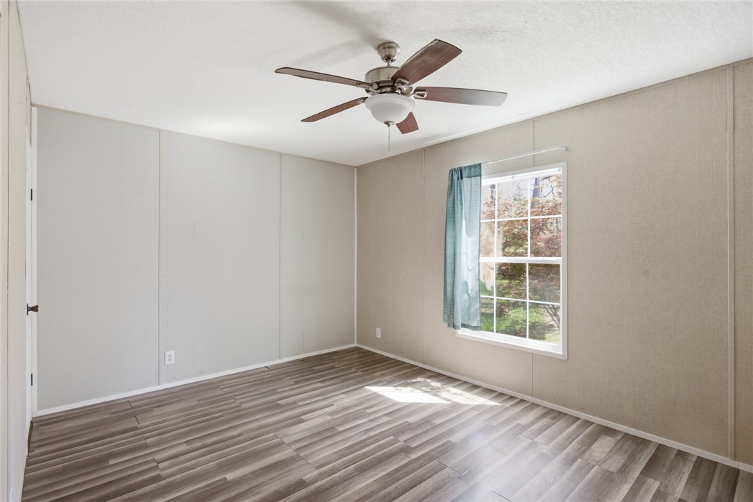 289 Bauknight Road Mountain Rest, SC 29664 - Photo 26 of 36 This spacious bedroom offers ample natural light and comfortable flooring, perfect for relaxation.