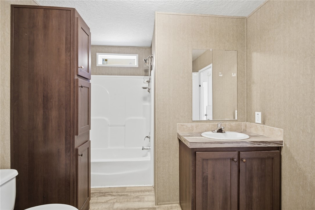 289 Bauknight Road Mountain Rest, SC 29664 - Photo 29 of 36 This functional bathroom features a shower-tub combo and a practical vanity with storage.