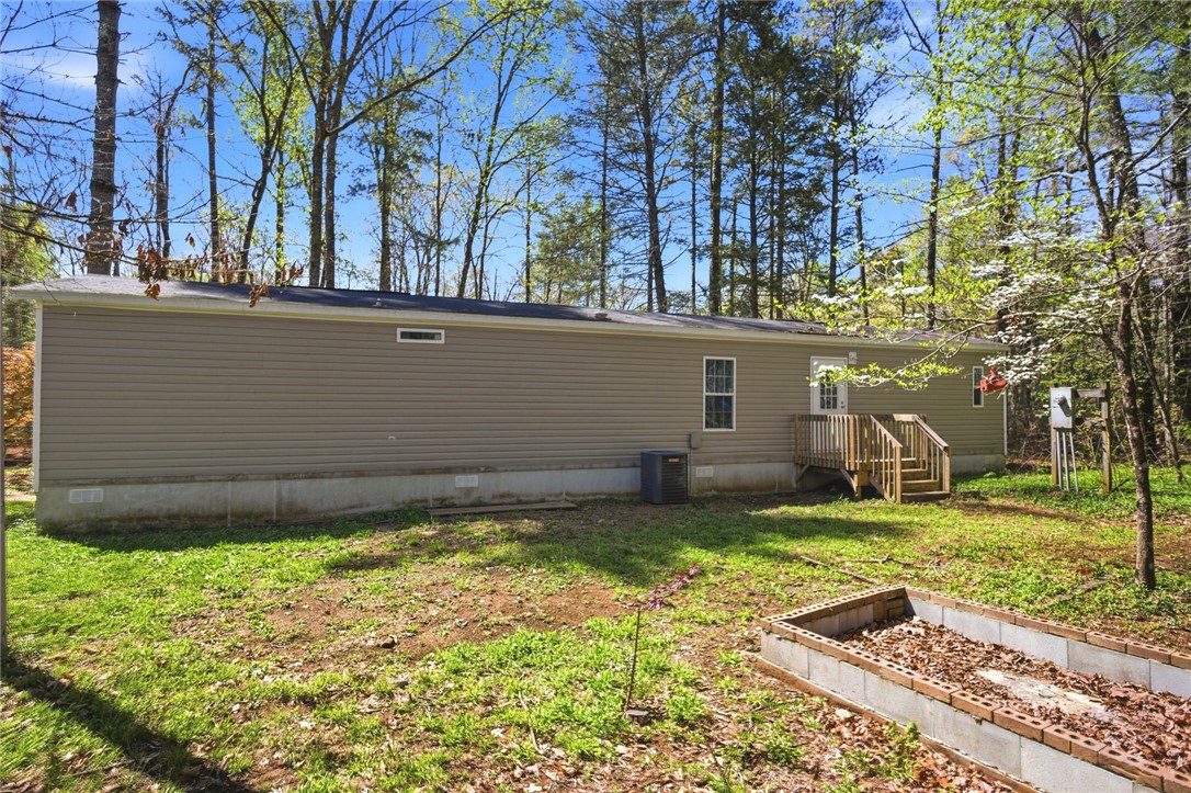 289 Bauknight Road Mountain Rest, SC 29664 - Photo 33 of 36 This charming home is nestled among trees, offering a serene escape.